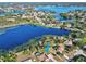 Aerial view of house near lake, showcasing waterfront property at 2332 Salem Dr, Deltona, FL 32738