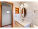 Updated bathroom with vanity, mirror and built-in shelving at 2332 Salem Dr, Deltona, FL 32738