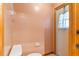 Small bathroom with toilet and exterior access at 2332 Salem Dr, Deltona, FL 32738