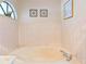 Bathroom with a bathtub and updated fixtures at 2332 Salem Dr, Deltona, FL 32738