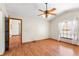 Bright bedroom with hardwood floors and access to another room at 2332 Salem Dr, Deltona, FL 32738