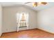 Bright bedroom with laminate flooring and ceiling fan at 2332 Salem Dr, Deltona, FL 32738