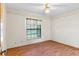 Bright bedroom with wood flooring and large window at 2332 Salem Dr, Deltona, FL 32738