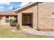 Brick house exterior with a covered entryway and landscaping at 2332 Salem Dr, Deltona, FL 32738
