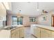 Kitchen with double sink, white cabinets, and water views at 2332 Salem Dr, Deltona, FL 32738