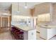 White kitchen features a large island with seating and ample counter space at 2332 Salem Dr, Deltona, FL 32738