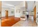 Bright living room with hardwood floors and a view into the kitchen at 2332 Salem Dr, Deltona, FL 32738