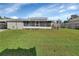 Home with screened porch and large backyard at 24514 Snail Rd, Astor, FL 32102