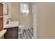 Updated bathroom with walk-in shower and modern vanity at 24514 Snail Rd, Astor, FL 32102