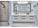 Double vanity bathroom with updated fixtures at 24514 Snail Rd, Astor, FL 32102