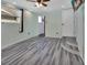Spacious bedroom with wood-look floors and ceiling fan at 24514 Snail Rd, Astor, FL 32102