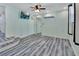 Light and airy bedroom with wood-look floors at 24514 Snail Rd, Astor, FL 32102