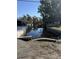 Peaceful waterfront view of a canal with boats and lush vegetation at 24514 Snail Rd, Astor, FL 32102