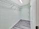 Well-lit closet with wire shelving at 24514 Snail Rd, Astor, FL 32102
