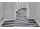 Clean hallway with grey laminate flooring at 24514 Snail Rd, Astor, FL 32102