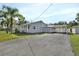 Single-story home with carport and driveway at 24514 Snail Rd, Astor, FL 32102