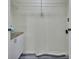 Laundry room with built-in shelving and cabinets at 24514 Snail Rd, Astor, FL 32102