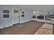Screened porch with access to the backyard at 24514 Snail Rd, Astor, FL 32102