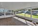 Bright screened porch overlooking the backyard at 24514 Snail Rd, Astor, FL 32102