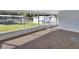 Spacious screened porch with backyard views at 24514 Snail Rd, Astor, FL 32102