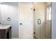 Bathroom with a vanity, glass shower, and light blue walls at 311 Ora St, Daytona Beach, FL 32118