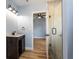 Bathroom with a vanity, glass shower, and light blue walls at 311 Ora St, Daytona Beach, FL 32118