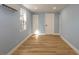 Light blue bedroom with hardwood floors and multiple closets at 311 Ora St, Daytona Beach, FL 32118