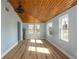 Spacious bedroom with light blue walls, wood flooring, and wood ceiling at 311 Ora St, Daytona Beach, FL 32118