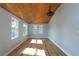 Bright bedroom with light blue walls, wood flooring, and wood ceiling at 311 Ora St, Daytona Beach, FL 32118