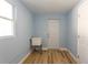 Laundry room with utility sink and wood flooring at 311 Ora St, Daytona Beach, FL 32118