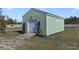 Large storage shed with roll-up door and ample space at 3150 Lori Ct, Deltona, FL 32738