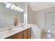 Double vanity bathroom with a large mirror and updated fixtures at 3190 Lori Ct, Deltona, FL 32738
