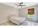 Bedroom with a metal bed frame and a window at 3190 Lori Ct, Deltona, FL 32738