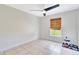 Well-lit bedroom with ceiling fan and tiled floor at 3190 Lori Ct, Deltona, FL 32738