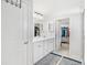 En-suite bathroom with double vanity and walk-in closet at 3404 Grassy Lake View Ave, Minneola, FL 34715