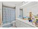 Clean bathroom, featuring double vanity and shower at 3404 Grassy Lake View Ave, Minneola, FL 34715