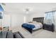 Main bedroom with a king-size bed and plenty of space at 3404 Grassy Lake View Ave, Minneola, FL 34715
