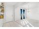 Bright entryway with tile floors, chandelier, and access to other rooms at 3404 Grassy Lake View Ave, Minneola, FL 34715