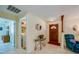 Bright entryway with tile flooring, built-in shelving, and a comfortable recliner at 3454 Country Walk Dr, Port Orange, FL 32129