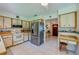 Kitchen with stainless steel appliances and a view into the entryway at 3454 Country Walk Dr, Port Orange, FL 32129