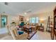Bright living room with comfy seating, a large window, and a ceiling fan at 3454 Country Walk Dr, Port Orange, FL 32129