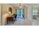 Bright office features built-in desk, tile floors, and access to a screened porch at 3454 Country Walk Dr, Port Orange, FL 32129