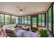 Relaxing sunroom with comfy seating, and views of the backyard at 3454 Country Walk Dr, Port Orange, FL 32129