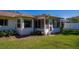 Sunroom addition with windows and a view of the backyard at 3454 Country Walk Dr, Port Orange, FL 32129