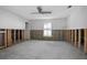 Unfinished bedroom with exposed framing and a window at 416 Lancaster Ave, Orange City, FL 32763