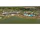 Aerial view of community with clubhouse, pool, and golf course at 4859 Nw 35Th Lane Rd, Ocala, FL 34482