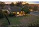 Attractive single story home with screened-in patio, well lit at dusk at 4859 Nw 35Th Lane Rd, Ocala, FL 34482