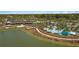 Aerial view of resort-style pool and clubhouse near the lake at 4859 Nw 35Th Lane Rd, Ocala, FL 34482