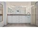 Double vanity bathroom with granite countertops and walk-in shower at 4859 Nw 35Th Lane Rd, Ocala, FL 34482