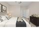 Spacious bedroom with large bed, neutral tones, and ample closet space at 4859 Nw 35Th Lane Rd, Ocala, FL 34482